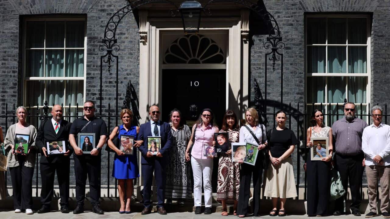 A group of bereaved parents arrive at 10 Downing Street in London, Britain (EPA-ANDY RAIN).jpg