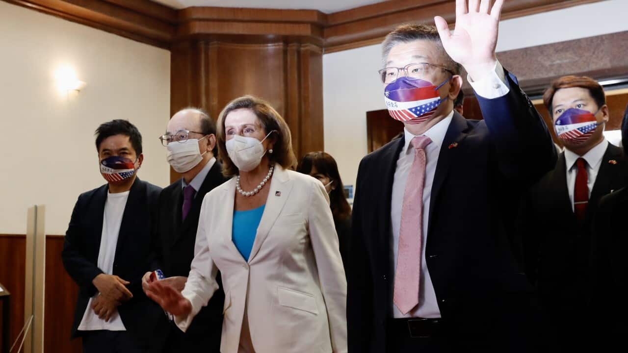 US House Speaker Nancy Pelosi walks with Taiwanese politicians in Taipei (AAP)