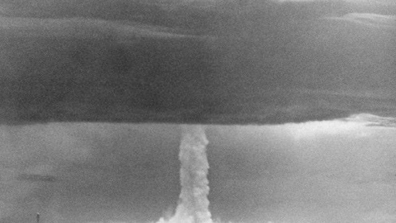 In this May 21, 1956 file photo, the stem of a hydrogen bomb, the first such nuclear device dropped from a U.S. aircraft, moves upward through a heavy cloud and comes through the top of the cloud, after the bomb was detonated over Namu Island in the Bikin