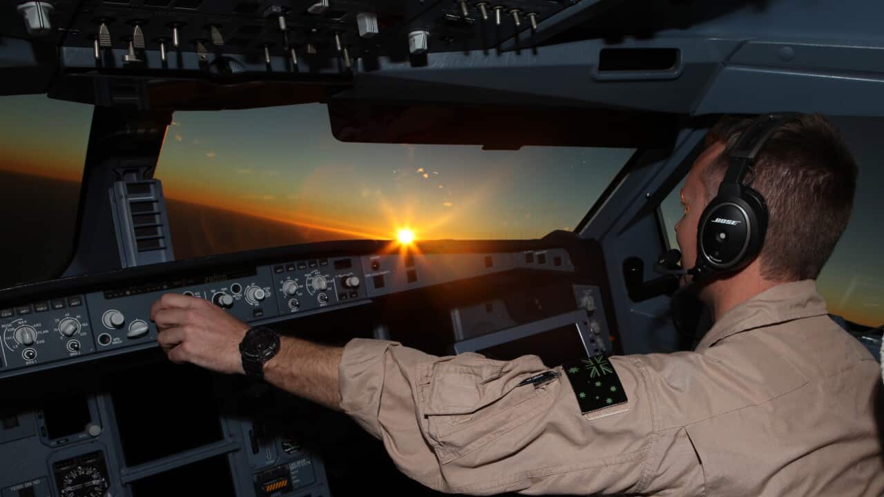 Royal Australian Air Force Air Task Group KC-30A Multi Role Tanker Transport pilot at work, as the sun sets during the first mission of Operation OKRA to be flown over Syria