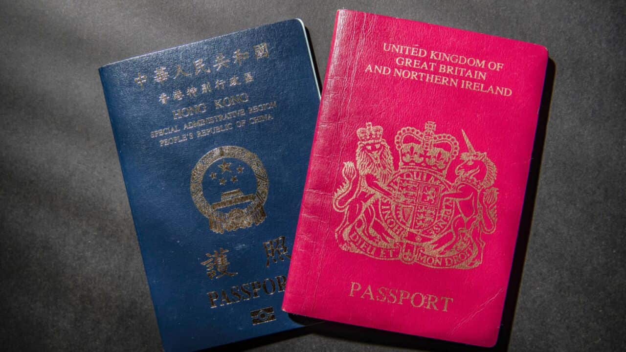 A British National Oversea (BNO) passport (R) and a Hong Kong passport (L)