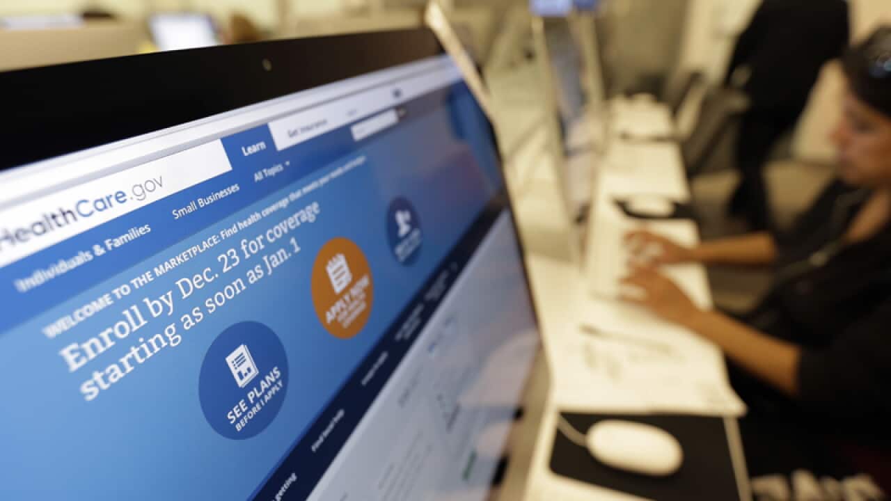 A woman access the Affordable Health Care Act website