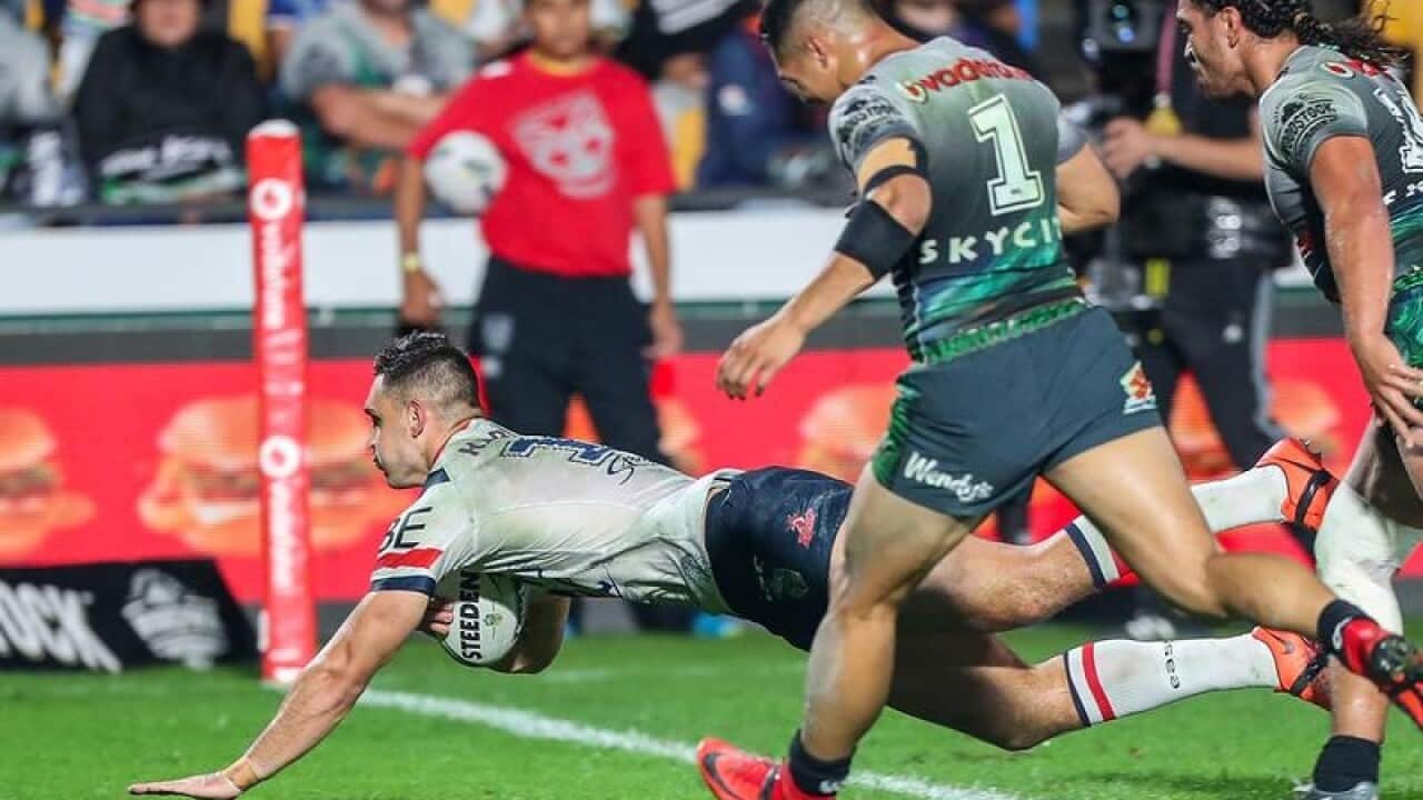 Ryan Matterson of the Roosters scores a try.