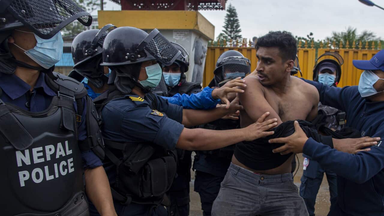 Nepali protestors affiliated with wings of main opposition political parties scuffle with riot police while burning an effigy of President Bidhya Devi Bhandari and Prime Minister K.P. Sharma Oli.