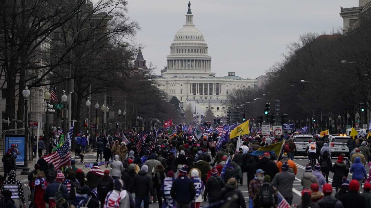 Supporters of President Donald Trump march on Pennsylvania Avenue towards the U.S. Capitol, Wednesday, Jan. 6, 2021, in Washington. (AP Photo/Jacquelyn Martin)