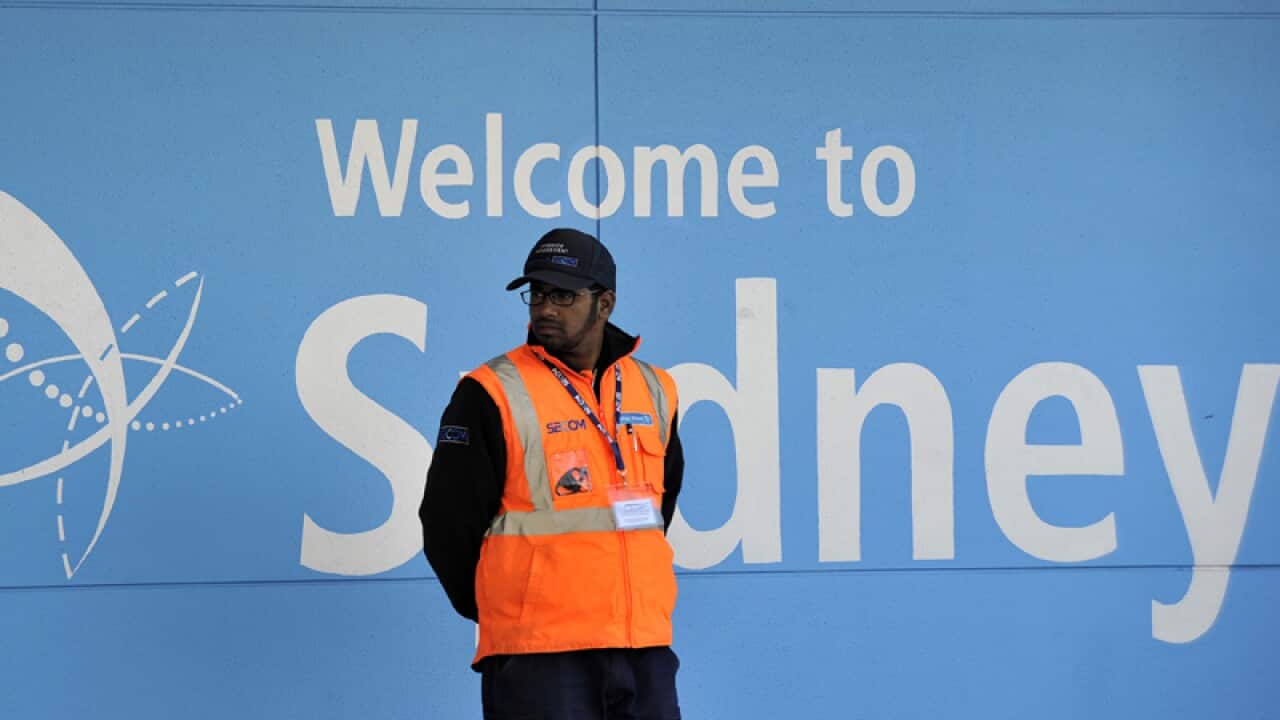 An airport worker is seen at Sydney International Airport
