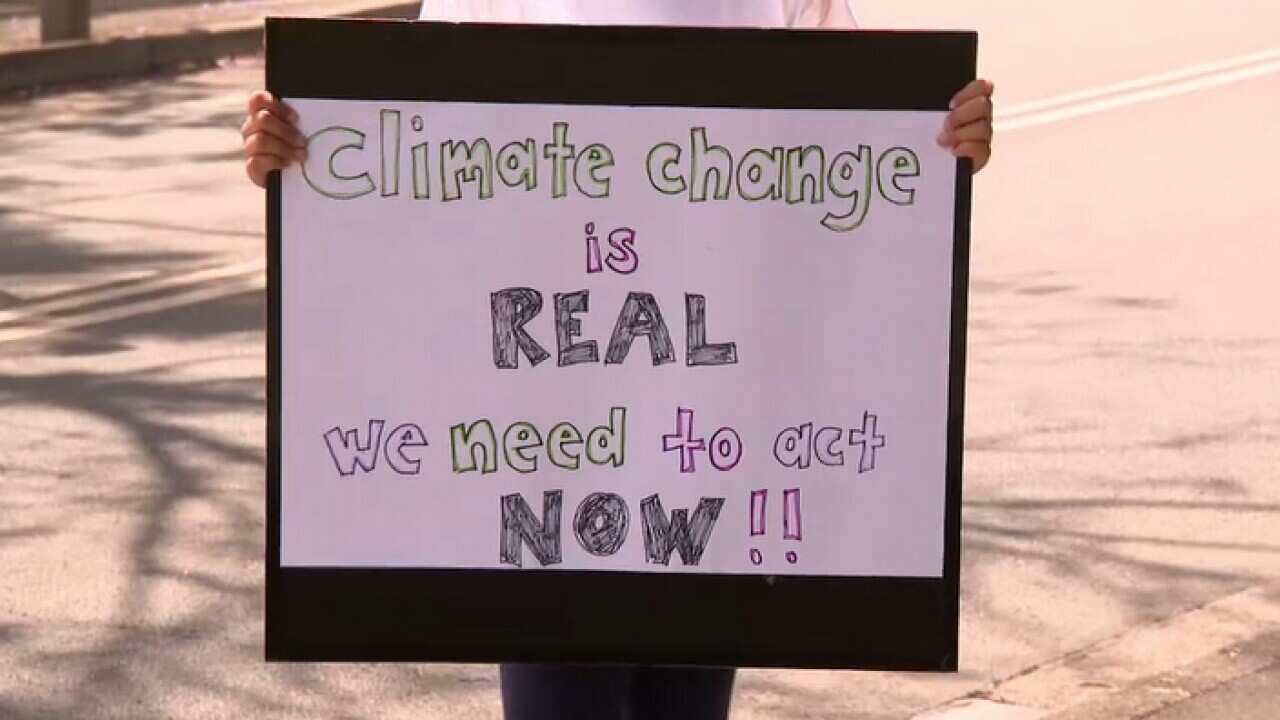 Lucie and her protest poster