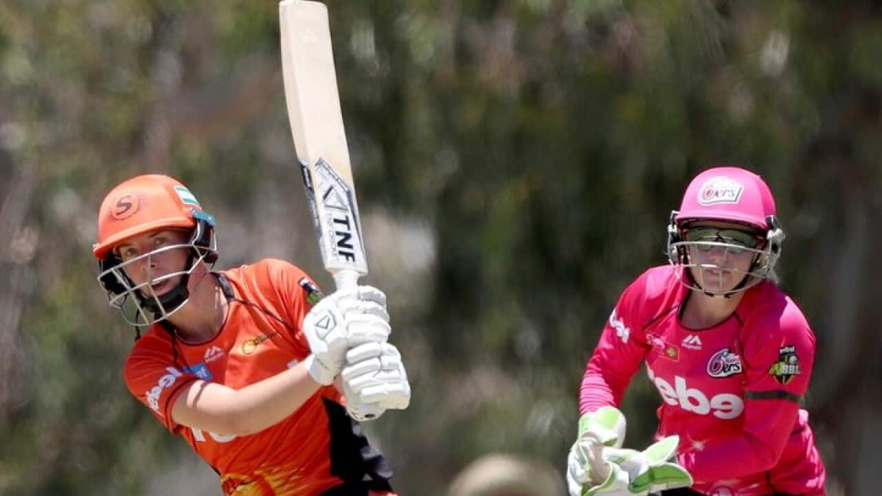 A file image of Elyse Villani of the Scorchers (L) bats