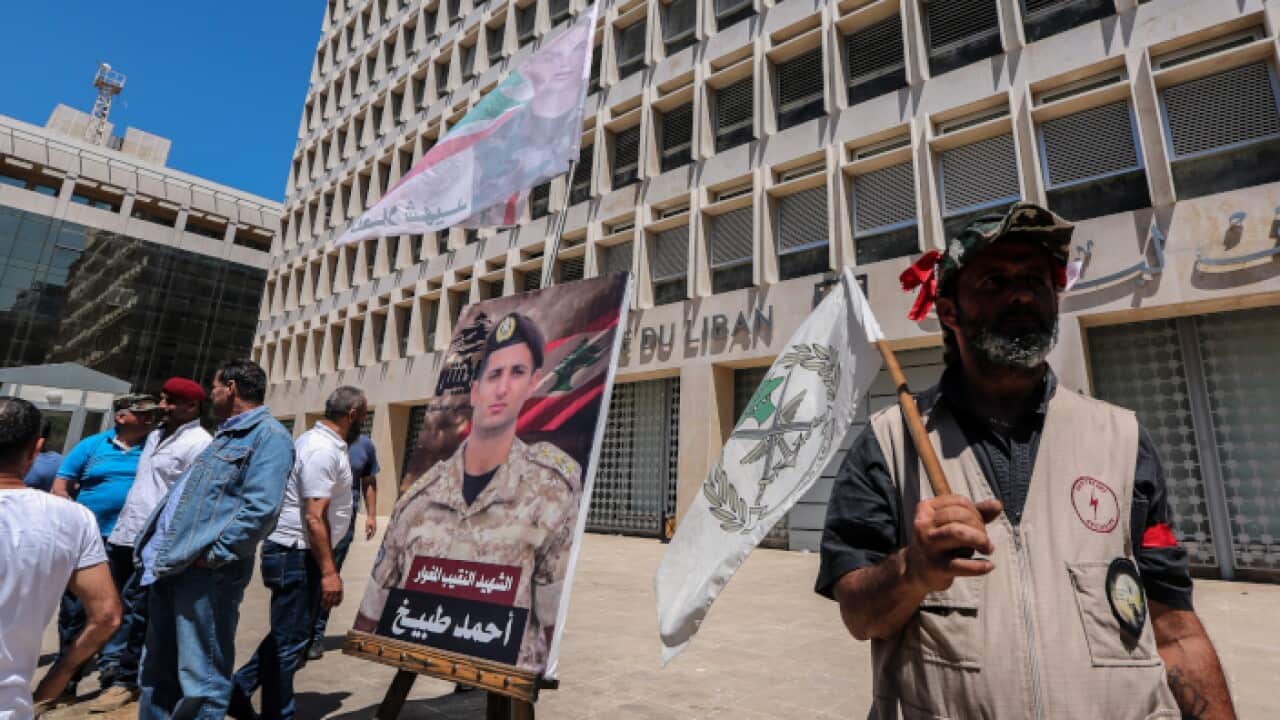 Retired army officers and soldiers protest in front of the Lebanese Central Bank in Hamra Street in Beirut, Lebanon,