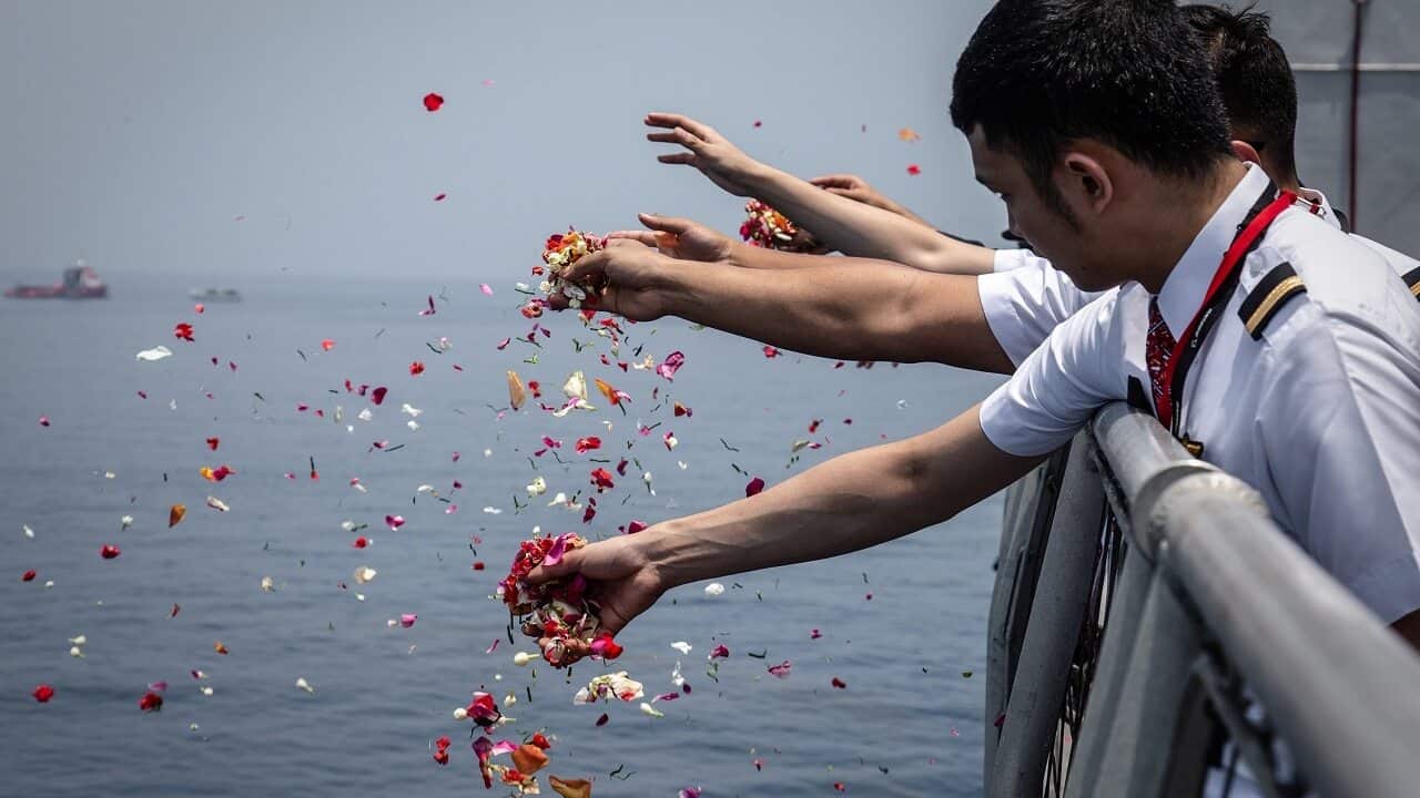 Colleagues of victims of Lion Air flight JT 610 throw flowers into the sea.
