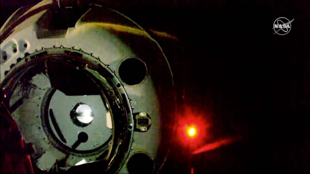 SpaceX's new crew capsule approaches just before docking at the International Space Station.