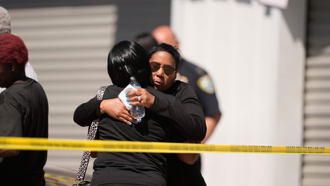Two people hung behind police tape