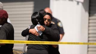 Two people hung behind police tape