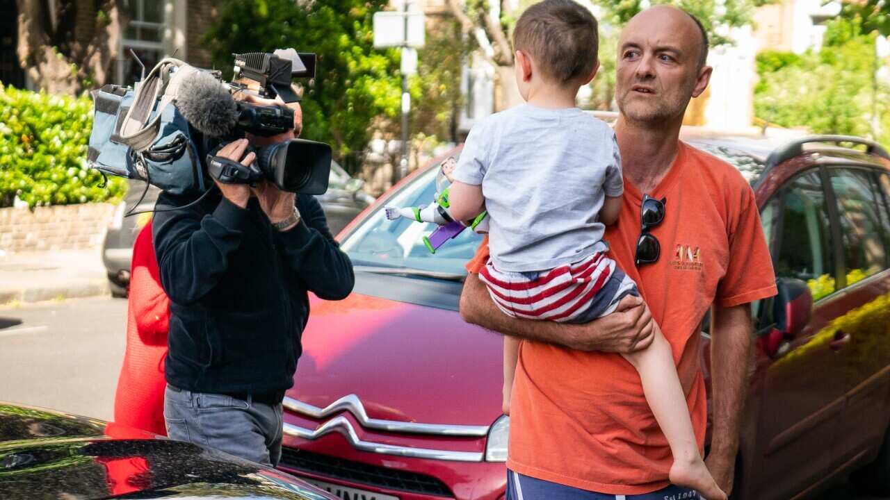 Prime Minister Boris Johnson's senior aid Dominic Cummings arrives at his north London home holding his son.