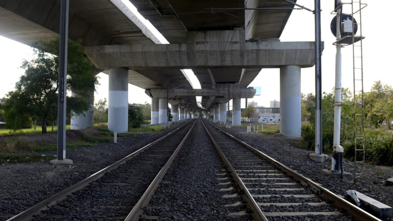 A city train track and road overpass in Melbourne.