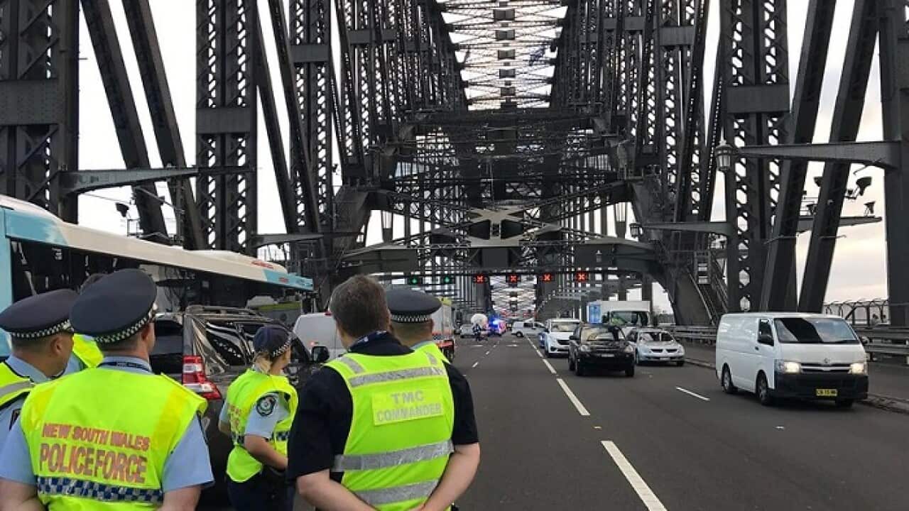 Man A man who climbed the Sydney Harbour Bridge, sparking a major police operation for more than five hours has been handcuffed by authorities and brought down.