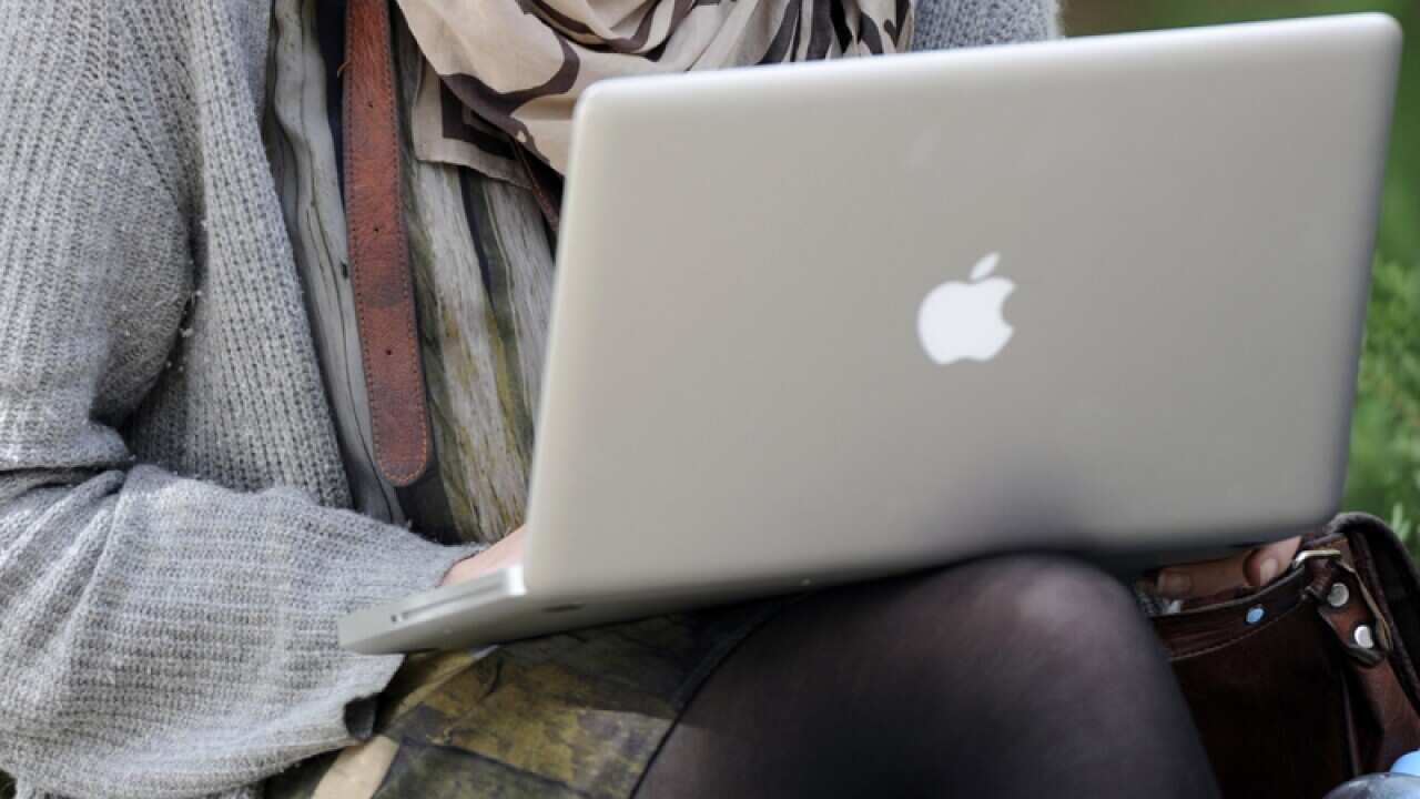 A student uses a laptop