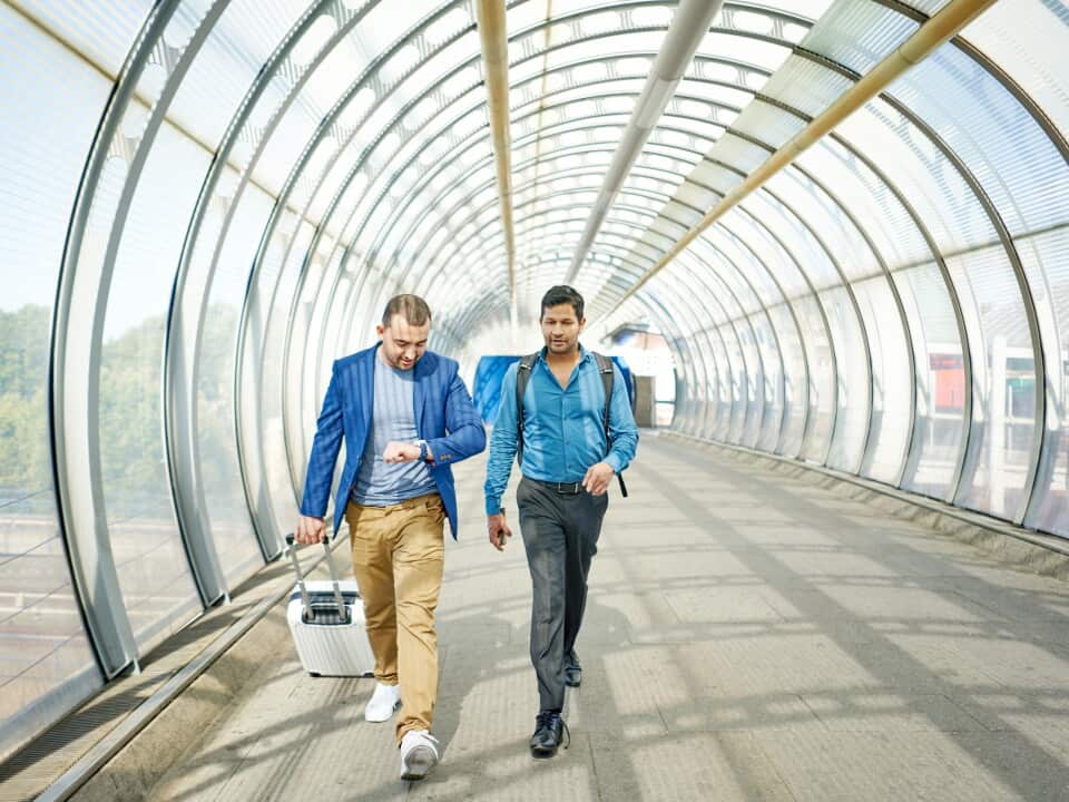 Two men walking together in a hurry