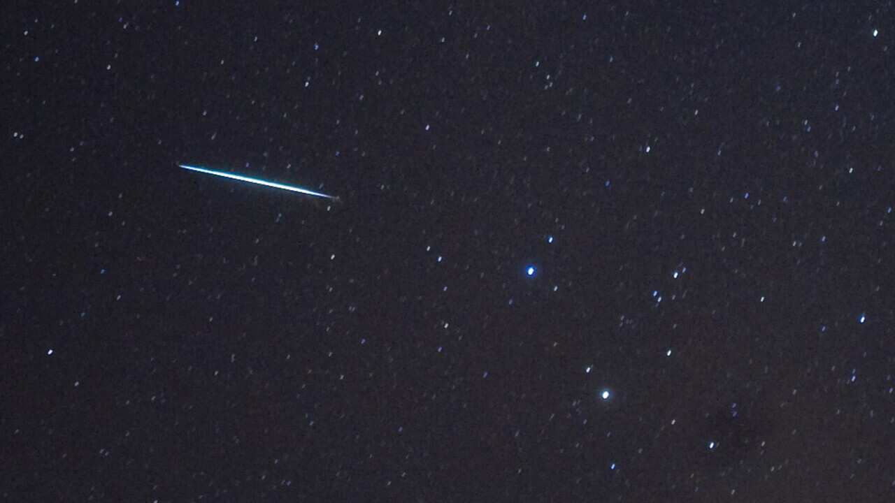 A meteor (L) from the Geminids meteor sh