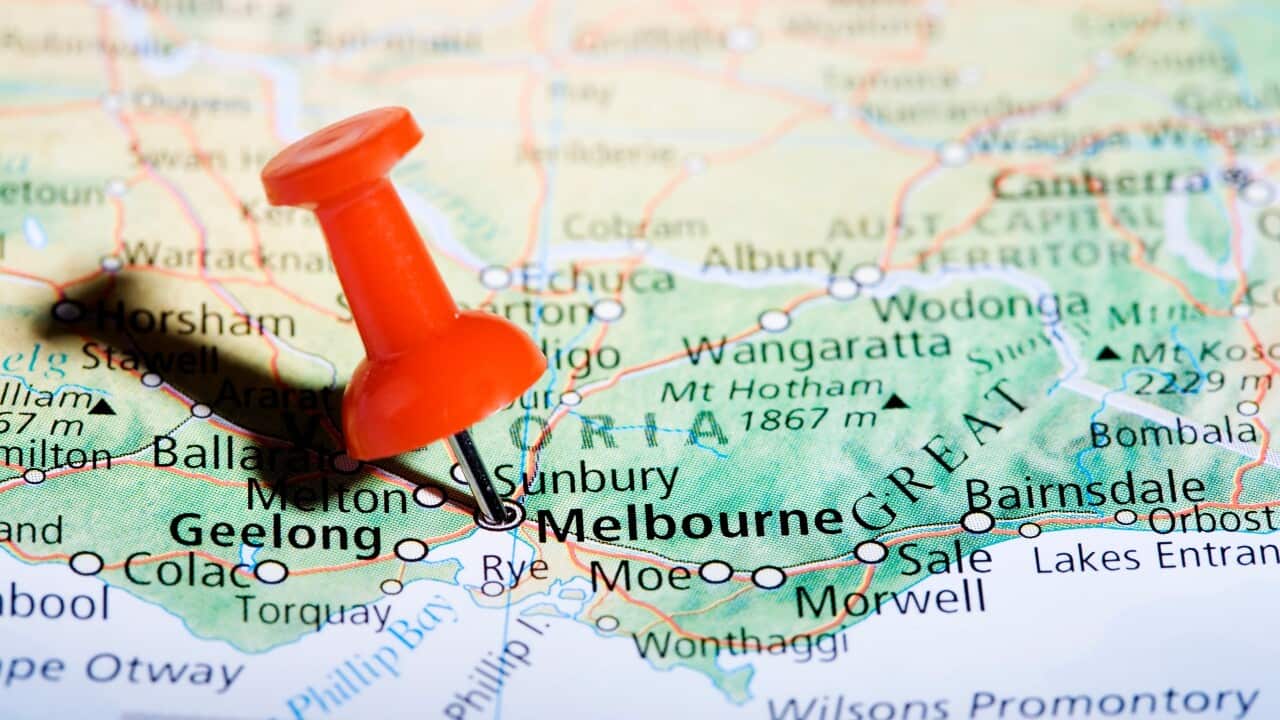 Close up of a map with a pin marking Melbourne, Victoria, Australia