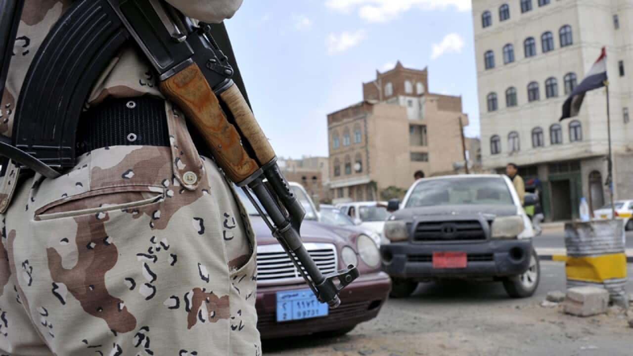 Yemeni army soldiers man a checkpoint in Sana'a