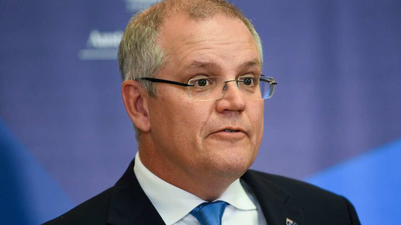 Mweka hazina wa Australia Scott Morrison akitangaza bajeti ya kati ya mwaka