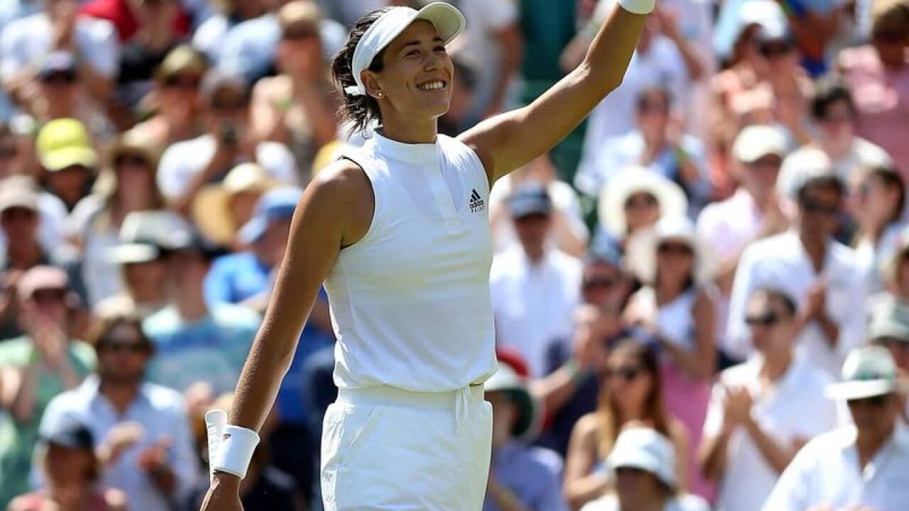 Garbine Muguruza safely through at Wimbledon.