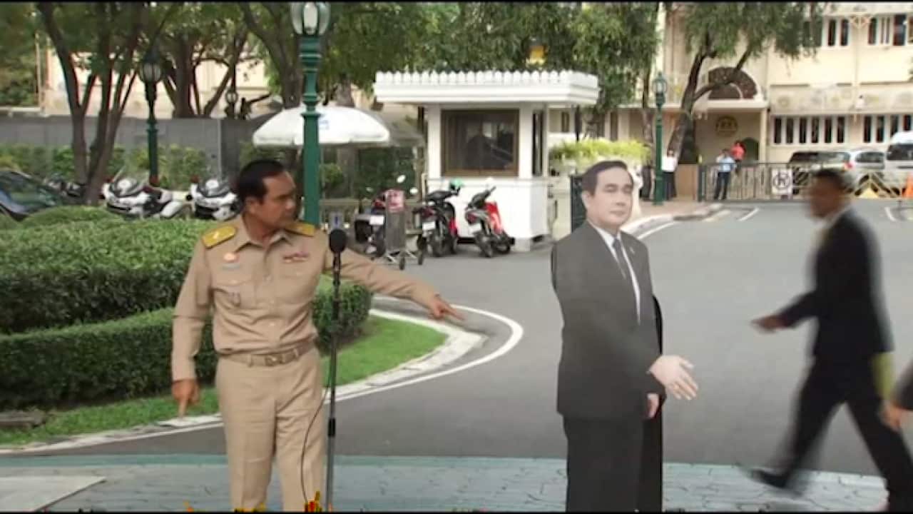 Thailand's Prime Minister on Monday evaded questions by bringing out a life-sized cardboard cut-out of himself, and telling reporters to "ask this guy" if they had "any questions on politics or conflict."