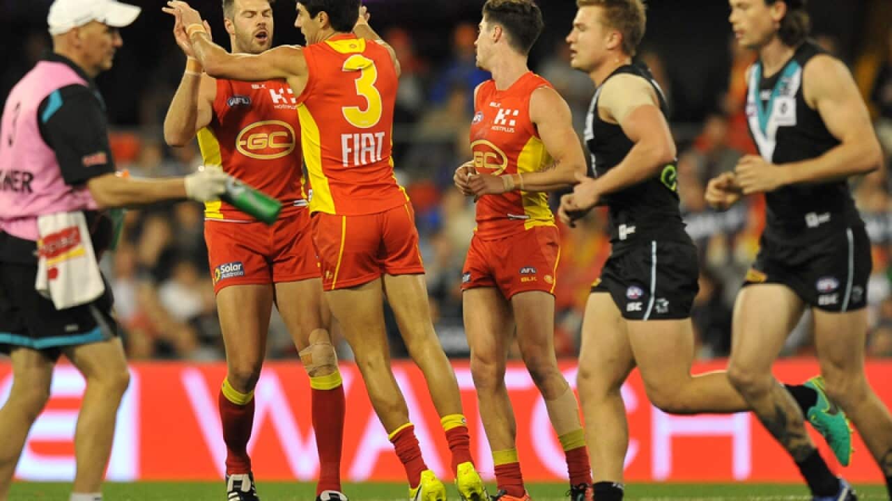 Gold Coast and Port Adelaide players