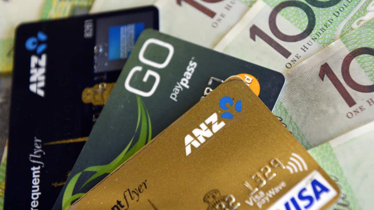 File photo of credit cards and money