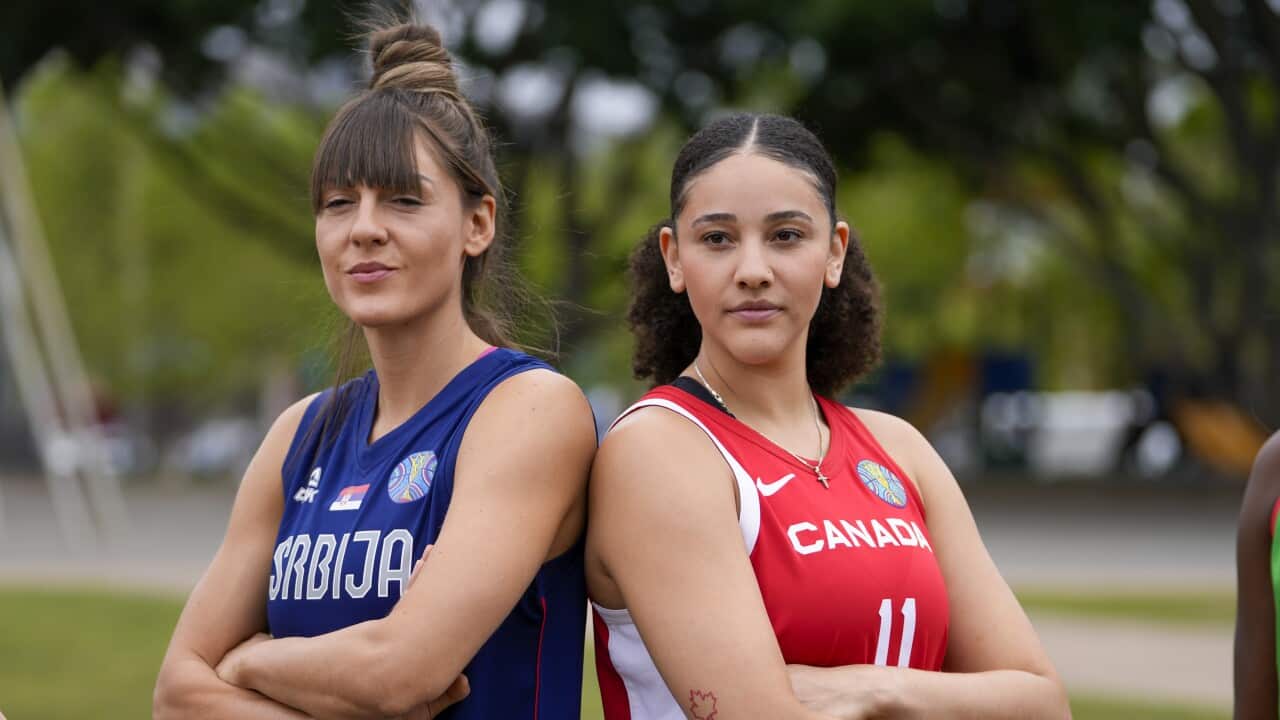 Serbia's Tina Krajisnik and Canada's Natalie Achonwa pose for a photo ahead of the two teams game in Sydney