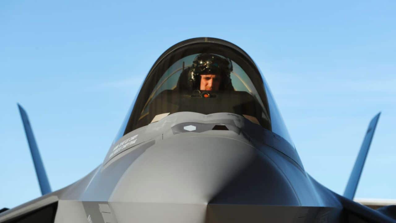 A pilot sits in the cockpit of an F-35 fighter jet preparing for a training mission at Hill Air Force Base in Ogden, Utah.