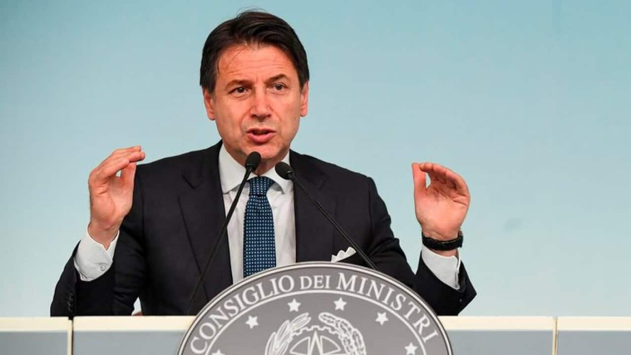 Italian Premier Giuseppe Conte speaks during a press conference following a cabinet meeting.