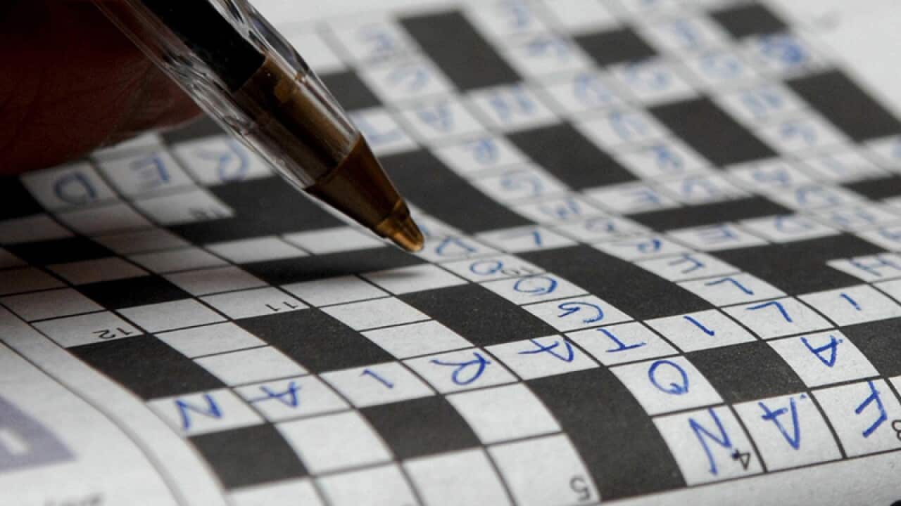 a crossword puzzle being completed.