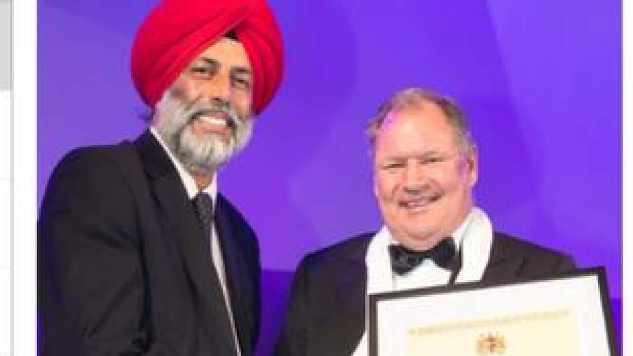 Mr Lakhwinder Singh Dhillon receiving a special award from the Lord Mayor, the Hon Robert Doyle