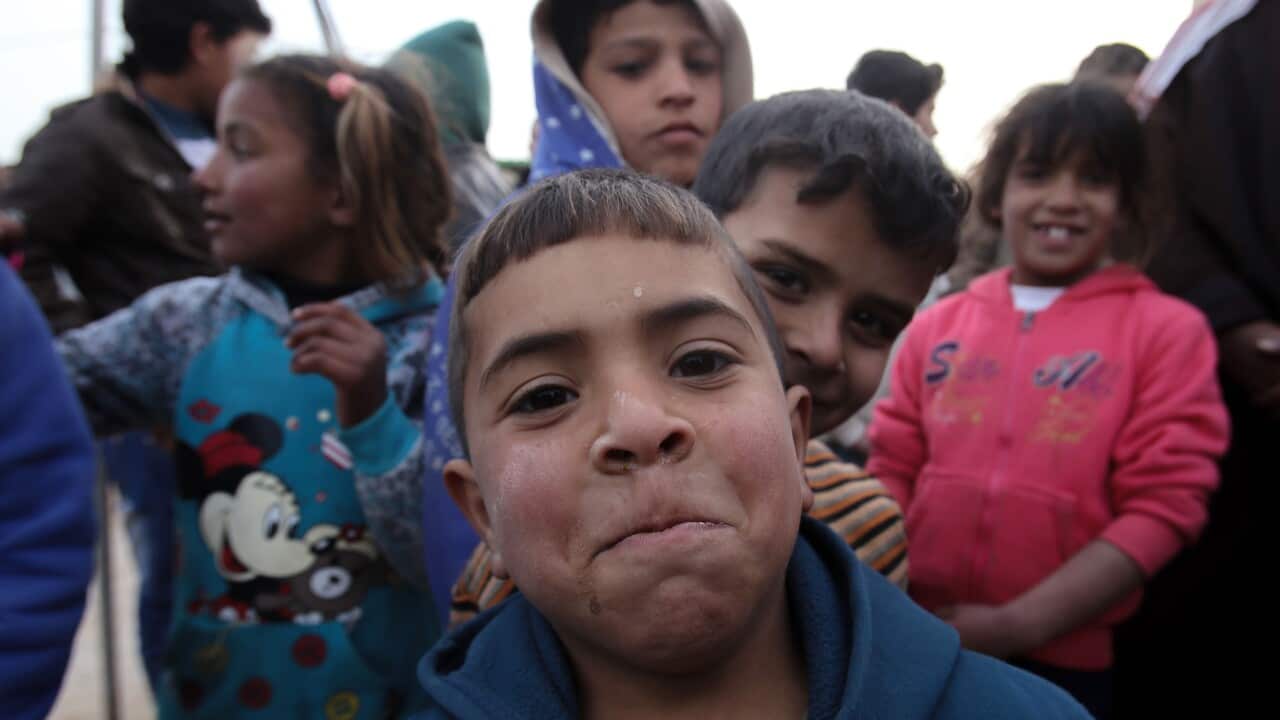 Syrian refugee children pose for a picture, during a visit by the new chief of the U.N. refugee agency, Filippo Grandi, at the Zaatari refugee camp, Mafraq, Jordan