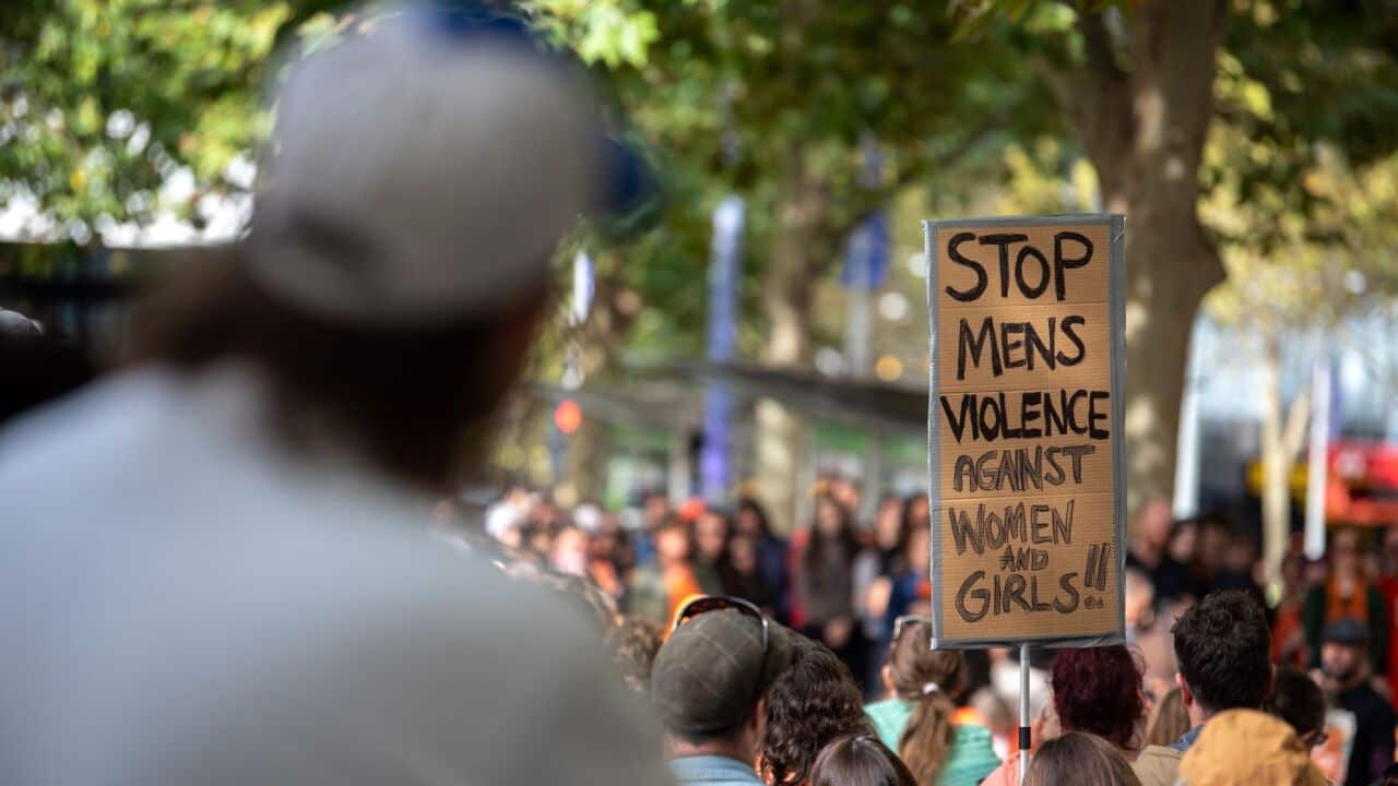 A sign reads 'Stop Men's Violence Against Women and Girls' during a rally for Isla Bell at the State Library of Victoria in Melbourne, Saturday, May 16, 2026 (AAP Image-Jay Kogler) .jpg