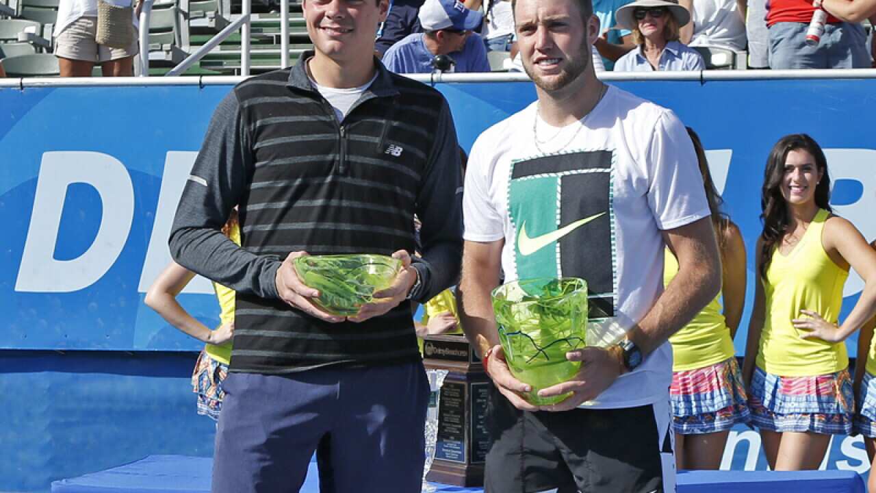 Milos Raonic and Jack Sock pose with their trophies