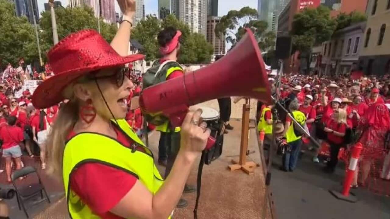 Tens of thousands of education workers have marched on Victoria's parliament over a pay dispute.