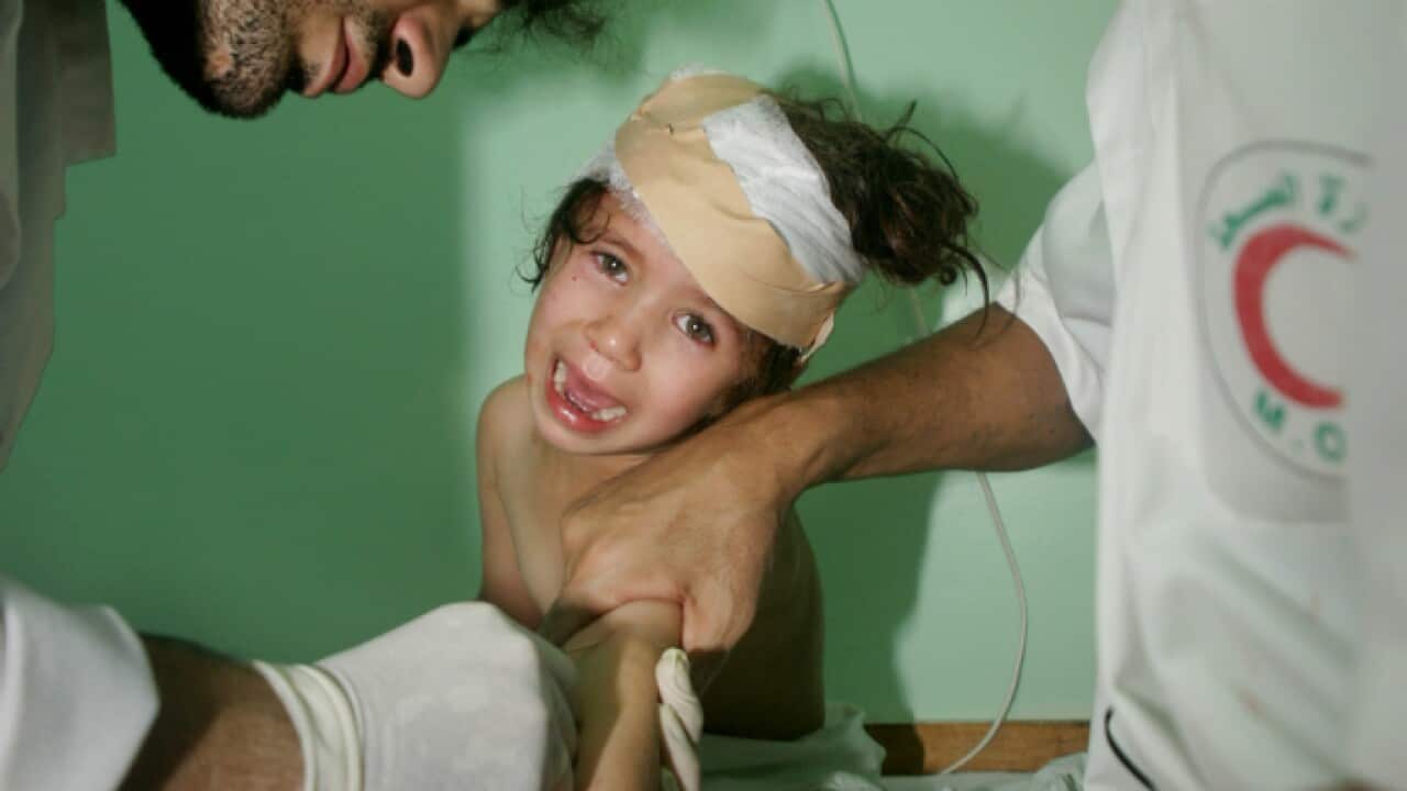 Palestinian three-year-old girl Sabrine Felfel is tended to by medics
