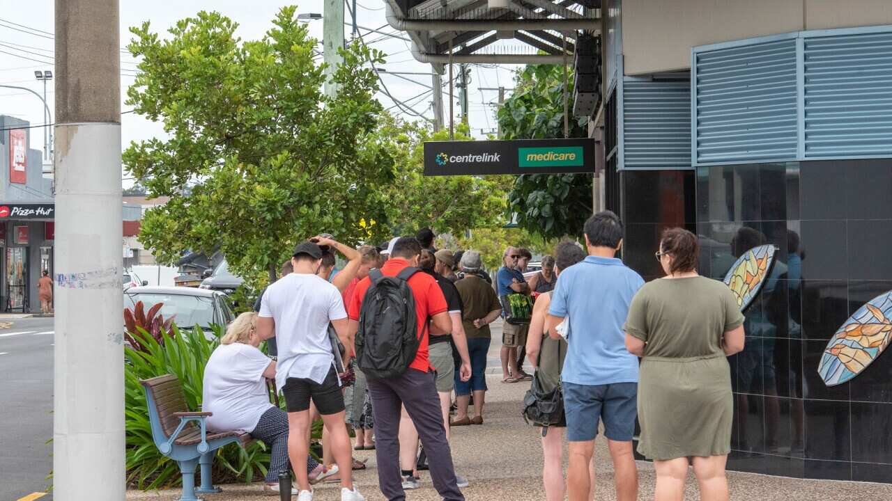 Australians queue at Centrelink during the COVID-19 pandemic