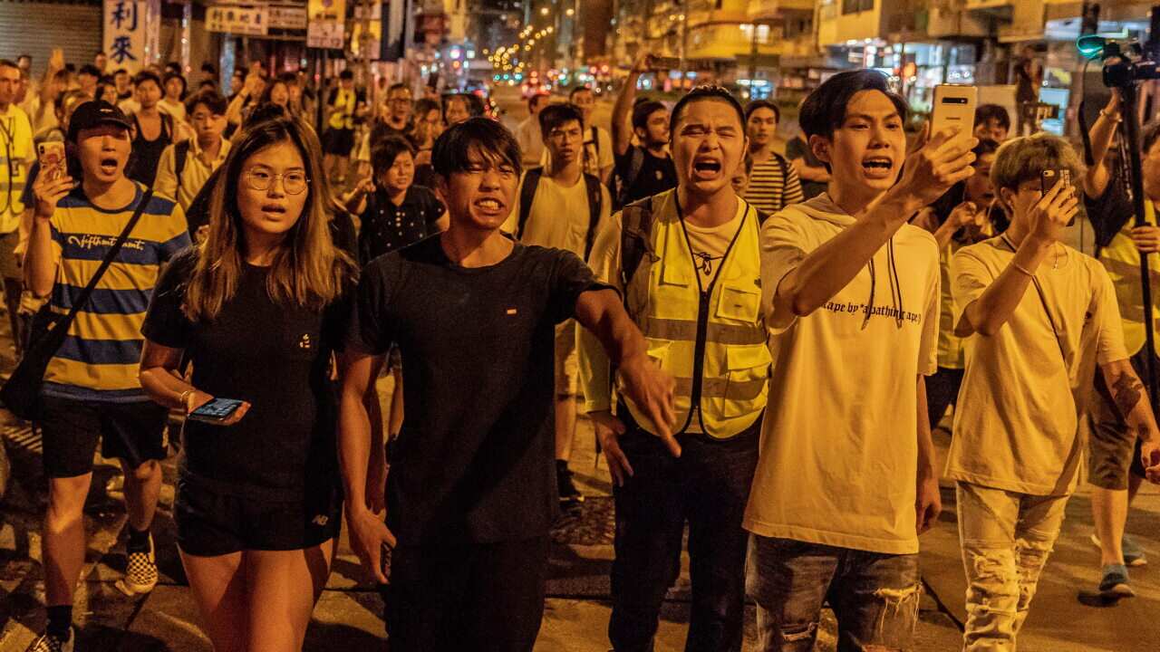 Local residents and protesters shout at police in Sham Shui Po.
