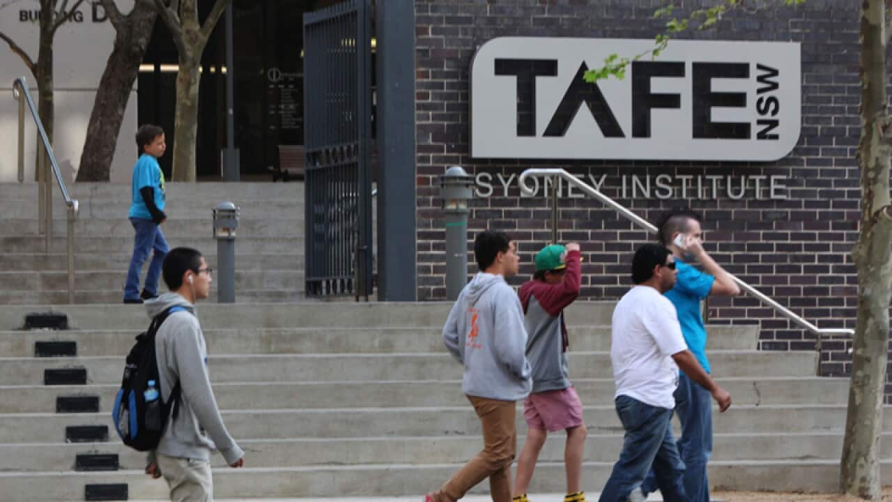 Pedestrians outside a TAFE NSW campus in Sydney