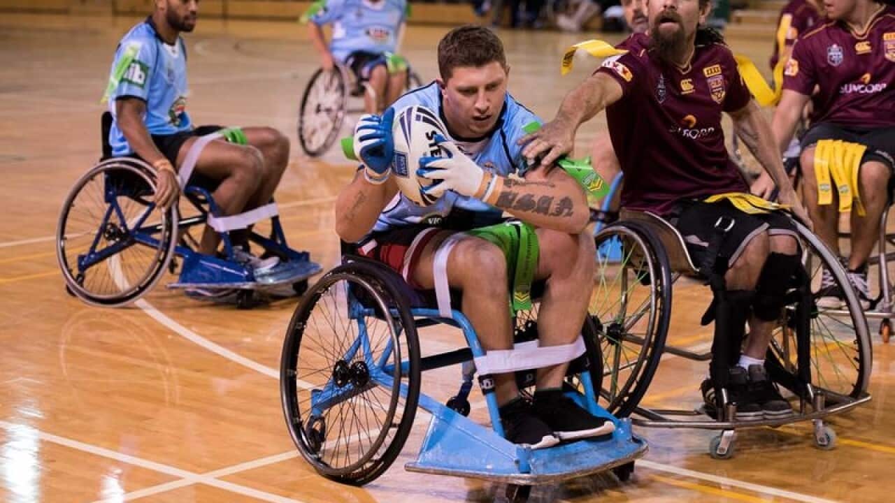 Athletes taking part in rugby league wheelchair rugby league.