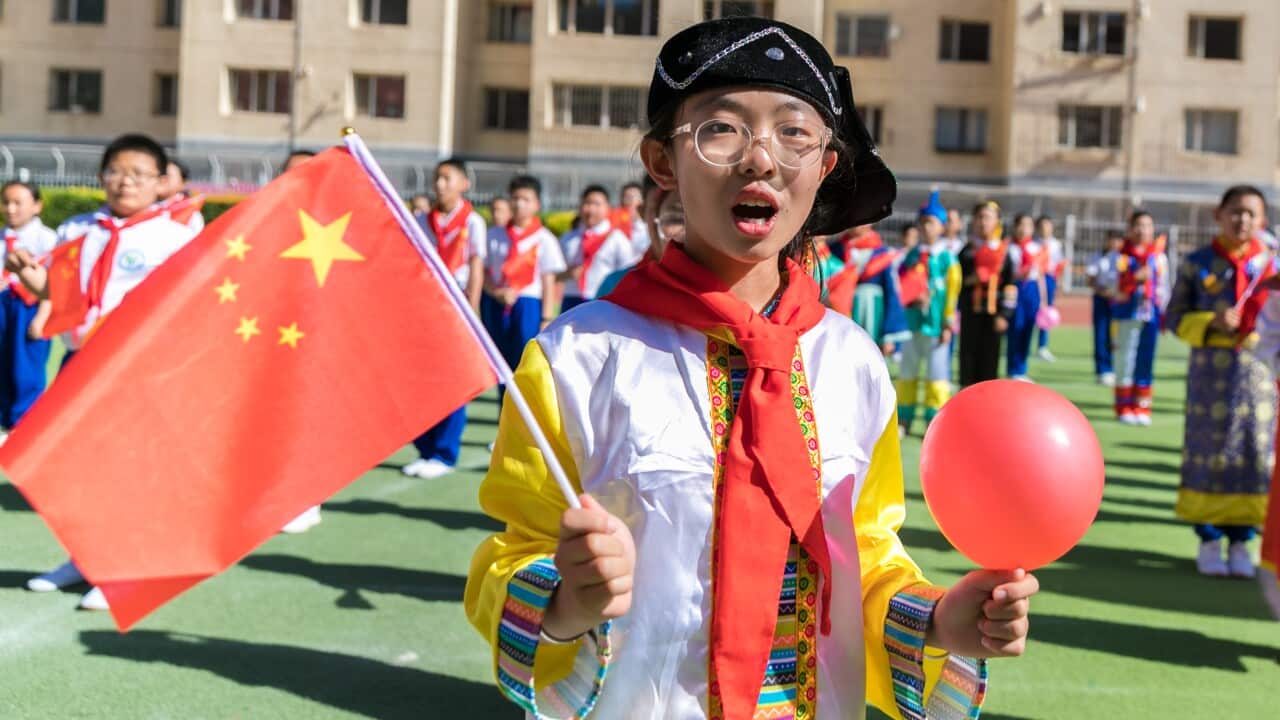 Primary school student and their teachers sing to celebrate the 100th anniversary of the CCP in Inner Mongolia.