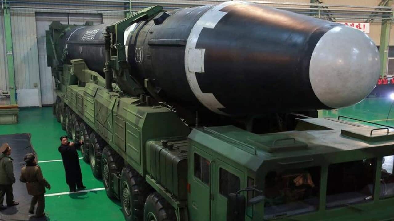 Kim Jong Un examining North Korea's intercontinental missile