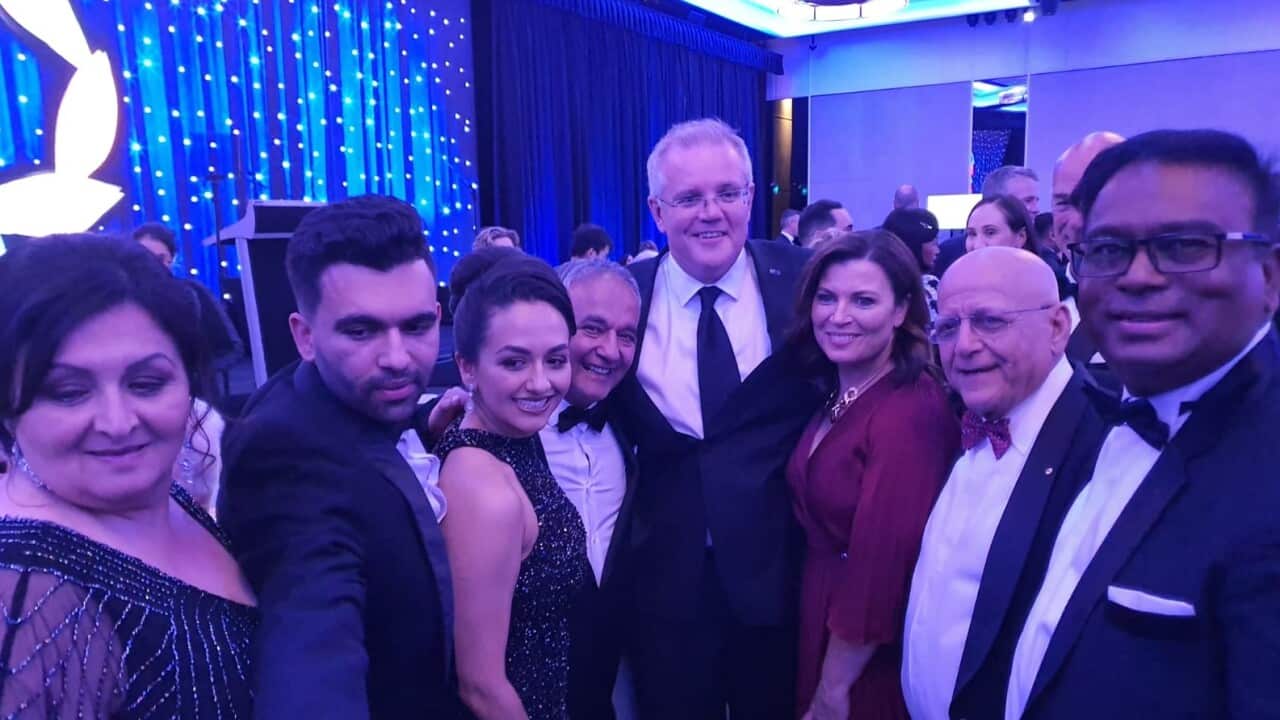 Basir Abbass with PM Morrison at the award ceremony