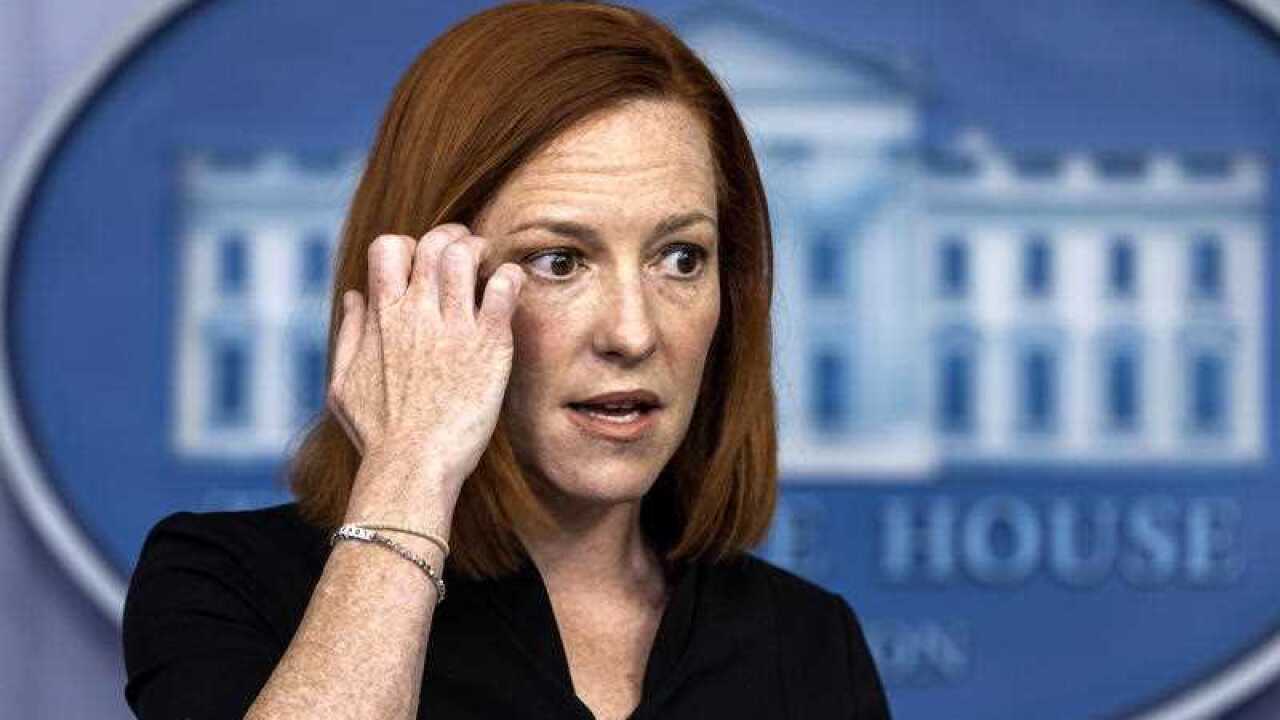 Jen Psaki said she had mild symptoms, for which she credited the COVID-19 vaccine, and said she was working from home.