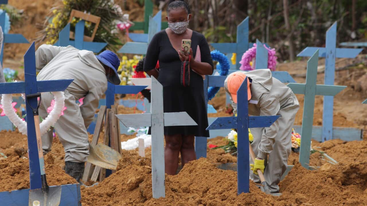 Workers at the cemetery Parque de Manaus in Manaus, Brazil.