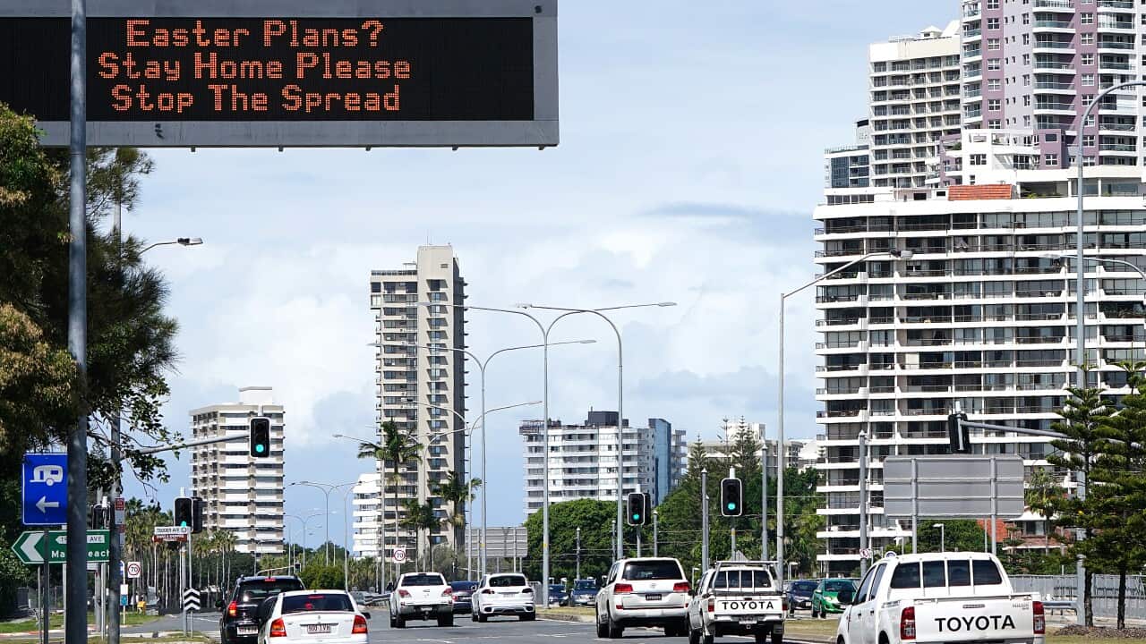 A sign warning to stay home over the Easter period is seen on approach to Surfers Paradise on the Gold Coast, Wednesday, April 8, 2020.